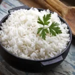 Steamed Rice garnished with coriander leaves served in a bowl