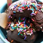 Chocolate ice cream garnished with sprinkles
