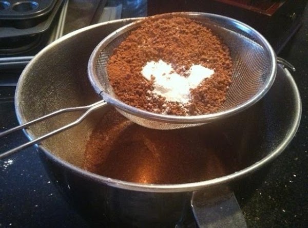 In a medium-sized bowl, sift together the flour, cocoa powder, baking powder, baking soda, and salt. Set aside.