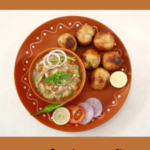 "Litti Chokha Recipe!!" and "queenofrecipes.online" written on an image with litti chokha