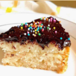 " Eggless Vanilla Cake Recipe!!" and "queenofrecipes.online" written on an image with Eggless Vanilla Cake.