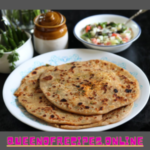 " Mooli Ka Paratha Recipe!!" and "queenofrecipes.online" written on an image with Mooli Ka Paratha.