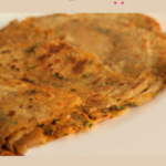 " Masala Paratha Recipe!!" and "queenofrecipes.online" are written on an image with a Masala Paratha.