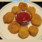 " Aloo Pakora Recipe!!" and "queenofrecipes.online" are written on an image with an Aloo Pakora.
